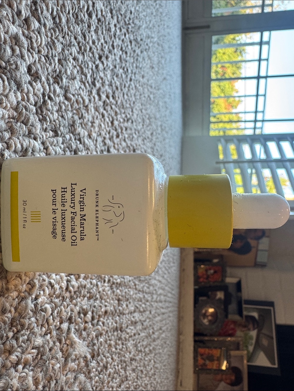 Drunk Elephant Facial Oil Bottle in Yellow and White